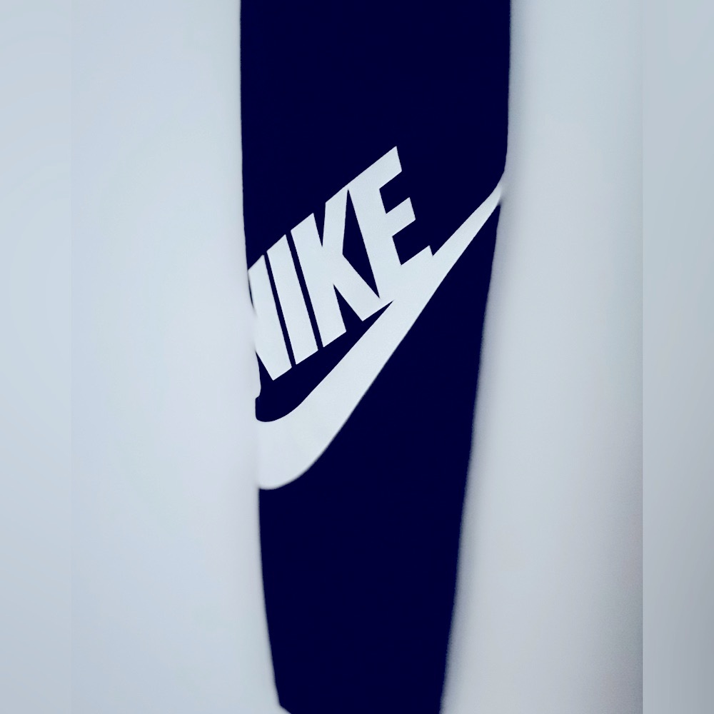 Two pairs of Nike leggings. Black. Green. Size S